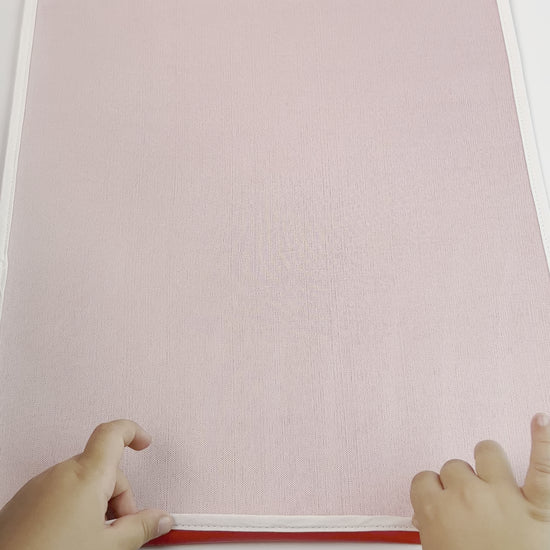 Red durable washable waterproof vinyl Montessori protector placemat - child rolling